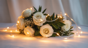 Small battery LED string lights glowing warmly in a wedding décor setting on neutral background